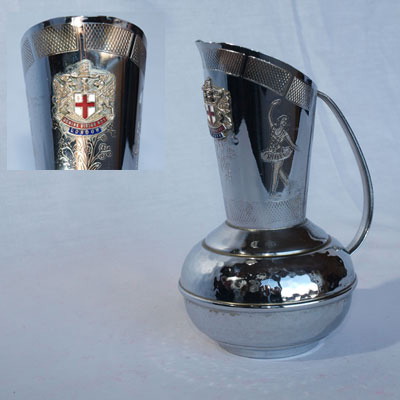 CHROME EWER BEARING  THE CITY OF LONDON COAT OF ARMS BADGE.